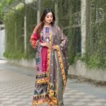 digital print salwar suit featuring a vibrant red tunic, patterned trousers, and a coordinating scarf