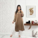 silk two-piece suit featuring vibrant neckline and sleeve embroidery